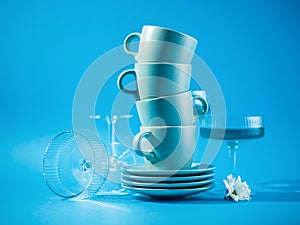 Blue cups and glasses over a blue background