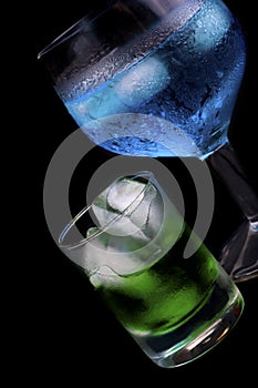 Blue Curacao and absinthe in a glass photo