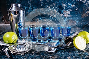 Blue curacao, alcoholic strong drinks. Cocktails and garnish at bar, pub or restaurant