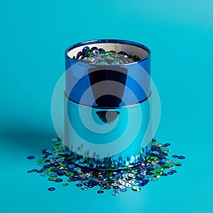 Blue Cylinder with Sequins Spilling Out