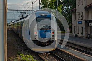 Blue czech trains near in Plzen town area in sunrise morning time
