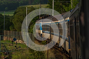 Blue czech trains near in Plzen town area in sunrise morning time