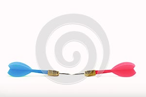 Blue dart against pink dart on white background - Concept of gender struggles