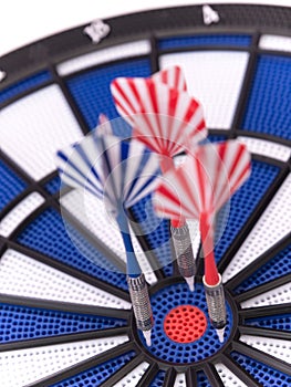 Blue dartboard with darts