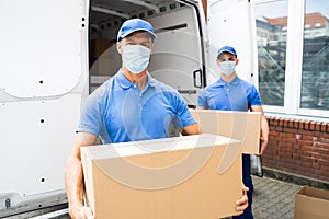 Blue Delivery Men Unloading Package From Truck