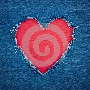 Blue denim background with red heart