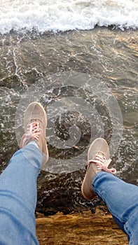 Blue denim with beautiful shoes near the sea