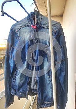 Blue denim jacket on the clothesline