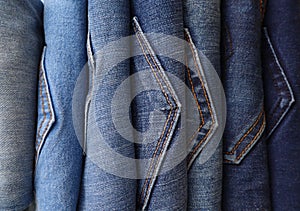 Row of Blue Denim Jeans in a Variety of Shades