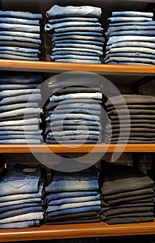 Blue denim jeans in rack in a clothing store