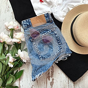 Blue denim shorts back on wooden background