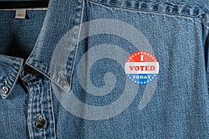 Blue denim working clothing with I Voted sticker