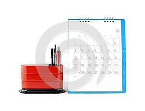 blue desk calendar with date grid in july 2016 and red desk organizer isolated on white background