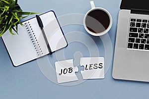 blue desktop flatlay, inscription jobless on a puzzle, computer, crisis 2020