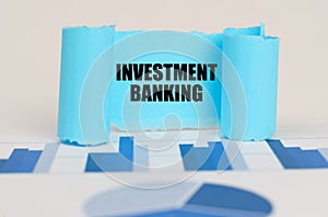 On the blue diagram and graphs there is a twisted paper plate with the inscription - Investment banking