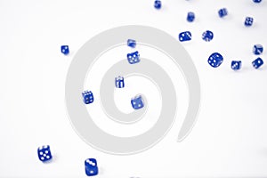 Blue Dice falling on a white background