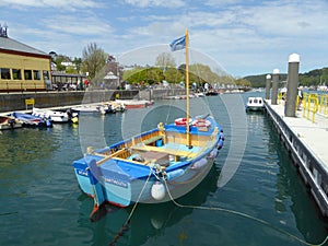 Blue dinghy in harbour