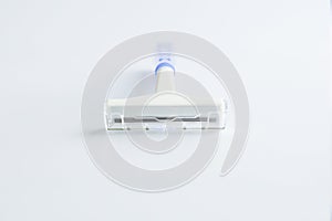 Blue disposable razor on a white background