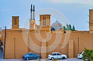 The blue dome behind adobe wall, Yazd, Iran