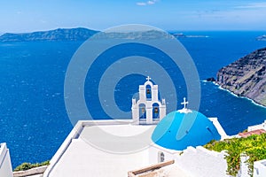 Blue dome and bell tower of famous Agios Theodori Church in Firostefani