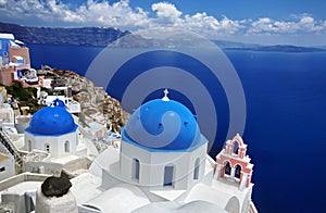 Blue dome church of beautiful Oia in Greek Island of Santorini,