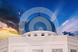 blue dome of modern white Masjid Minor Mosque in Tashkent in Uzbekistan on background of beautiful sky