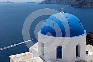 Blue domed churches on the Caldera at Oia on the Greek Island of