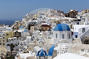 Blue domed churches on the Caldera at Oia on the Greek Island of