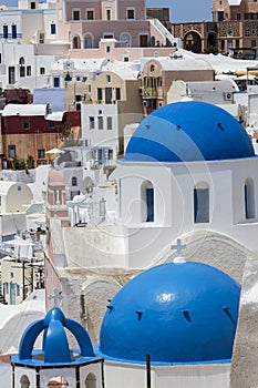Blue domed churches on the Caldera at Oia on the Greek Island of