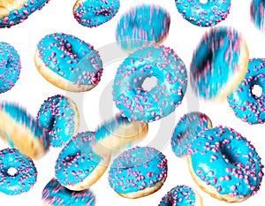 Blue donuts in a chaotic position in the air, isolated on a white background