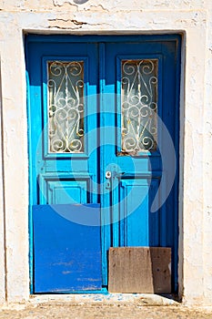 blue door in antique village santorini greece europe
