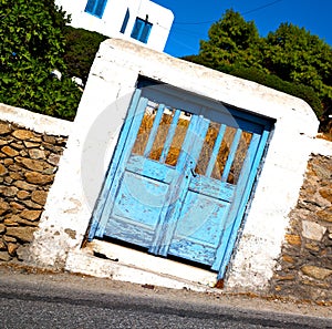 blue door in antique village santorini greece europe and whit
