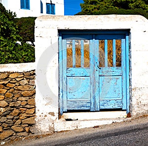 blue door in antique village santorini greece europe and whit