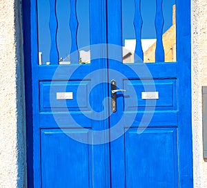 blue door in antique village santorini greece europe and white w
