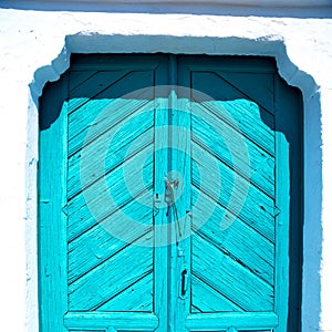 blue door in antique village santorini greece europe and white wall