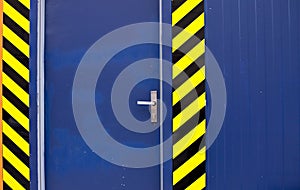 Blue door with black and yellow stripes: access denied, work in progress Prague, Czech Republic