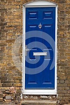 A blue door with a door step