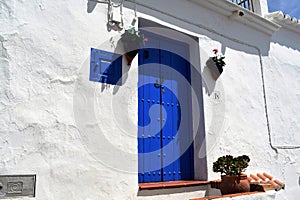 Blue door in Frigiliana, Spanish white village Andalusia photo