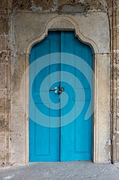 Blue door of a monastery, the color of the wood playing nicely w