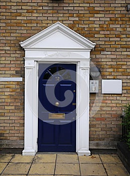 Blue door No.12 in old London houses in dockside
