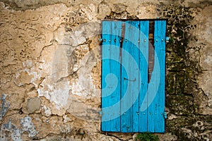 Blue door in old wall