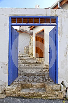 Blue door and stone steps in the old village of Laneia, Limassol district, Cyprus