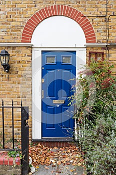 Blue door in typical british style in London, UK