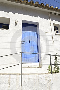 Blue door on white Mediterranean house