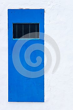 Blue door and white wall