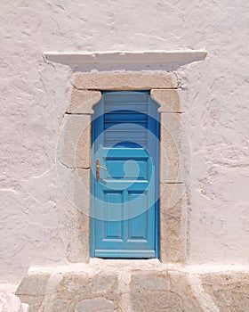 Blue door on whitewashed wall, Mykonos island, Greece