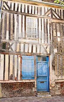 Blue door with window shutter of an old building