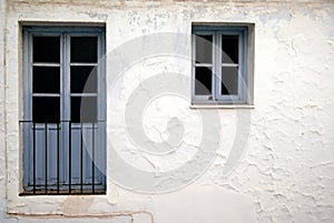 Blue door and window on white wall