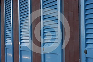 Blue doors at a beach in Italy