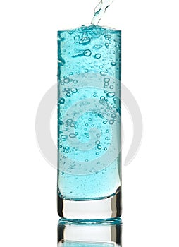 Blue drink being poured into a glass